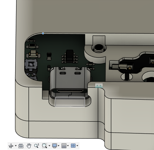 Cutout for tenting feet, showing an exposed screw and USB C port